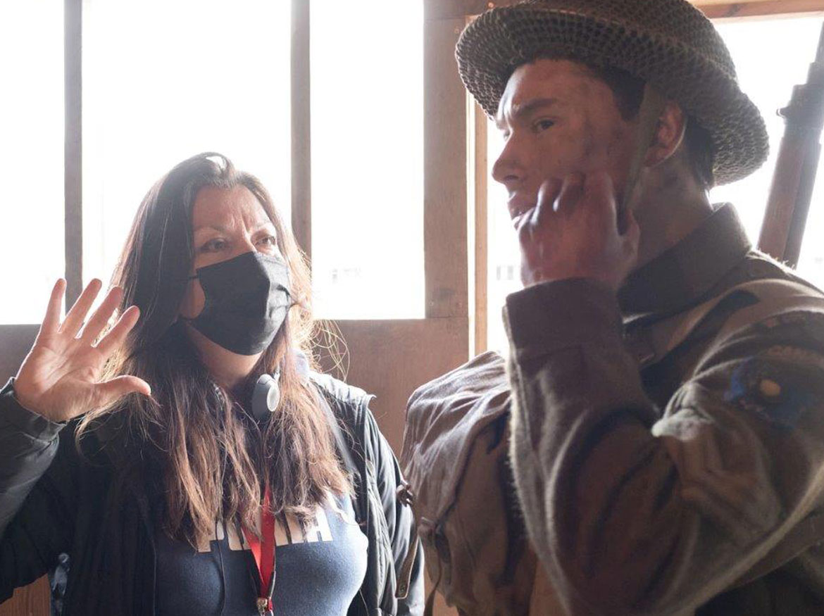 Director Marie Clements speaking with actor on the film set.